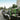 Man loading EGO Commercial equipment onto a landscaping trailer